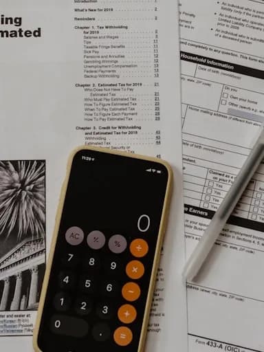 Prudential reporting screens and regulatory texts on a supervisor's desk