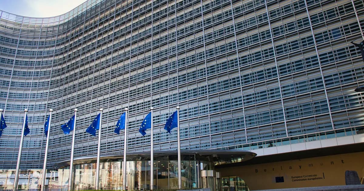 The Berlaymont building in Brussels, seat of the European Commission, with EU flags at the entrance